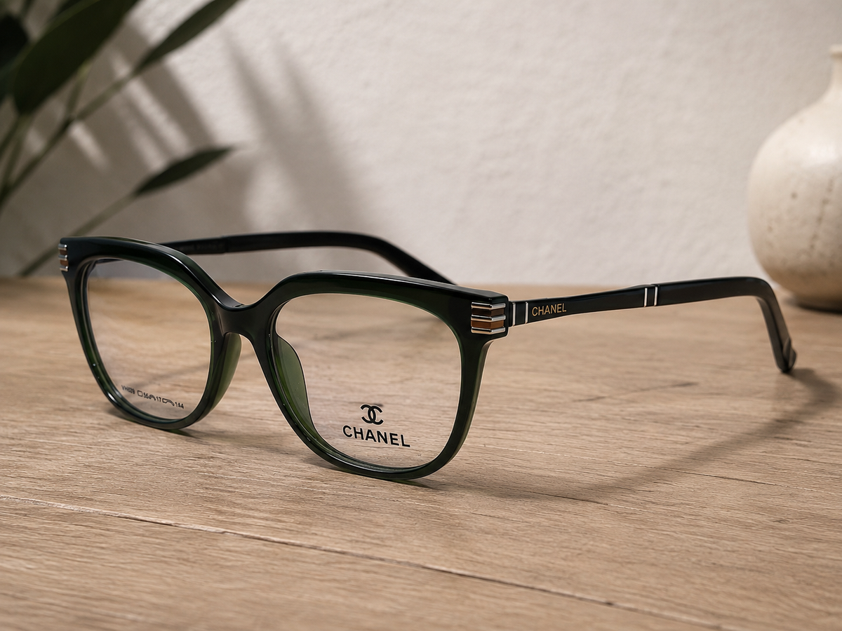 Chanel Cat-Eye Eyeglasses Dark Green - Wooden Table Lifestyle Angle View